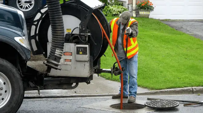 Technician using specialized drainage equipment for sewer line cleaning and foundation protection in Anchorage, AK